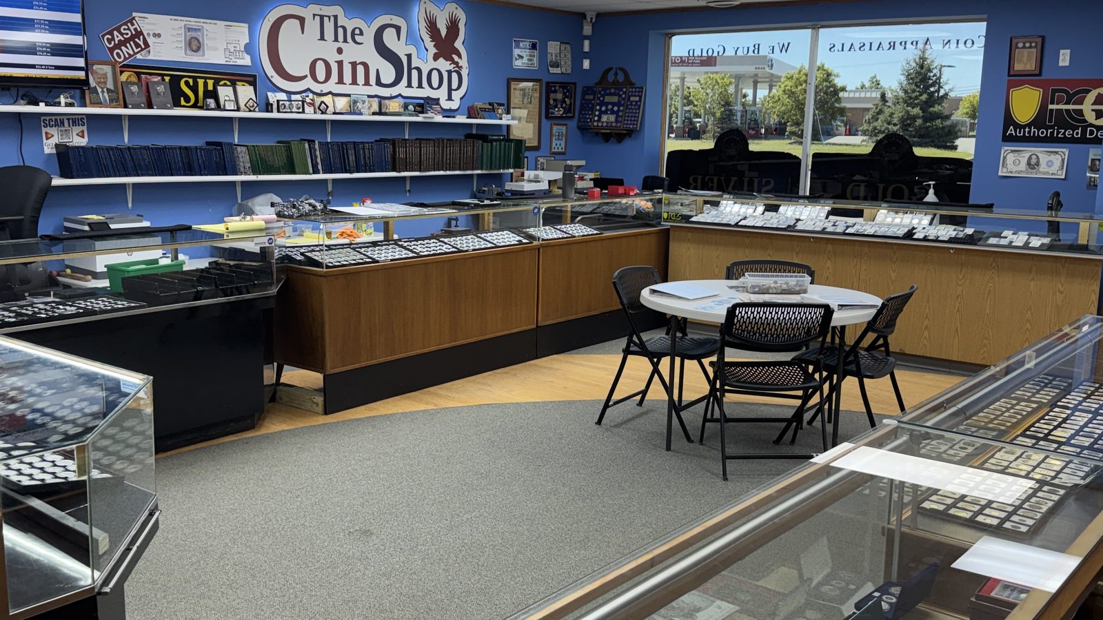 Main floor seating and coin cases at The Coin Shop