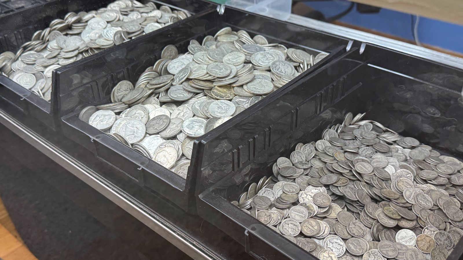 Bins of 90% junk silver halves and quarters